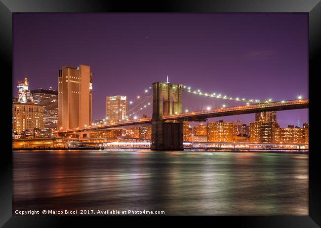 Night view of the Brooklyn Bridge  Framed Print by Marco Bicci