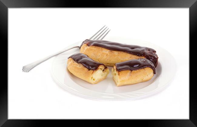 Two Chocolate Eclairs on a White Plate with a Fork Framed Print by Darryl Brooks