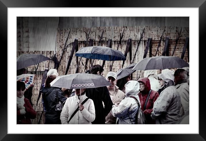 People in Rain Framed Mounted Print by Darryl Brooks