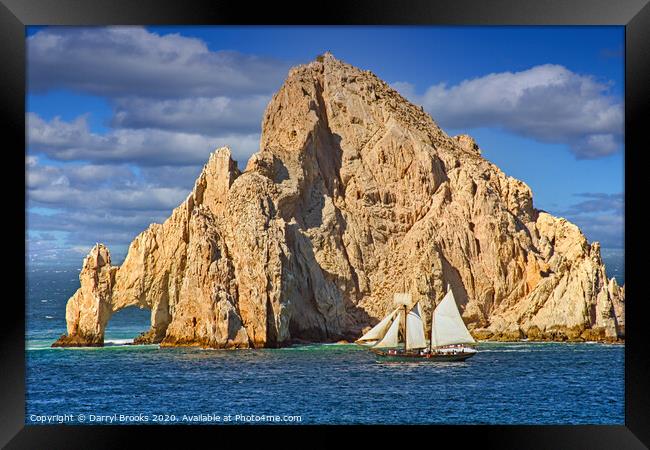 Sailboat Passing Rocks in Cabo San Lucas Framed Print by Darryl Brooks