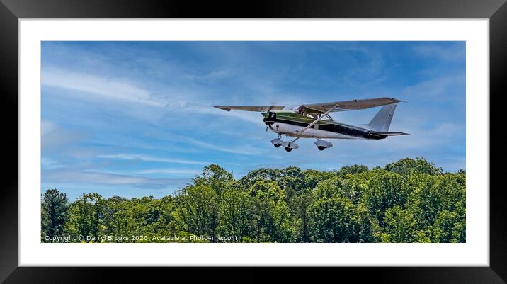 Green and White Plane in Flight Framed Mounted Print by Darryl Brooks