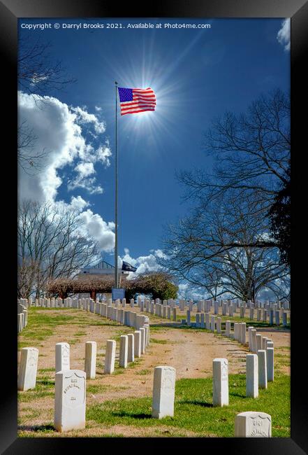 Sun Behind Flag at Cemetery Framed Print by Darryl Brooks