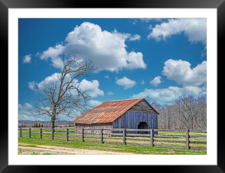Old Barn Beyond Fence Framed Mounted Print by Darryl Brooks