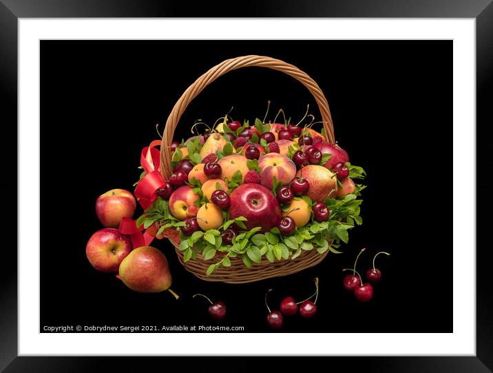 Basket with fresh fruits and berries on a black background Framed Mounted Print by Dobrydnev Sergei