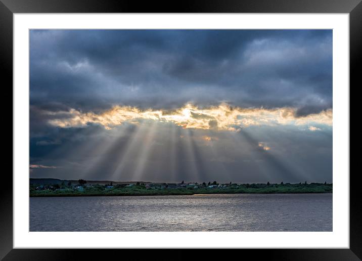 Beams of setting sun make the way through clouds Framed Mounted Print by Dobrydnev Sergei