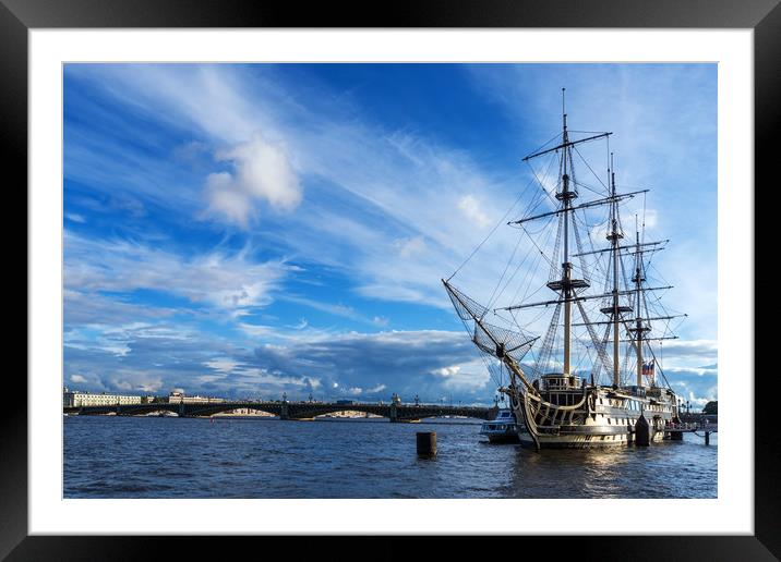 A sailing ship stands at the pier in the riverbed  Framed Mounted Print by Dobrydnev Sergei