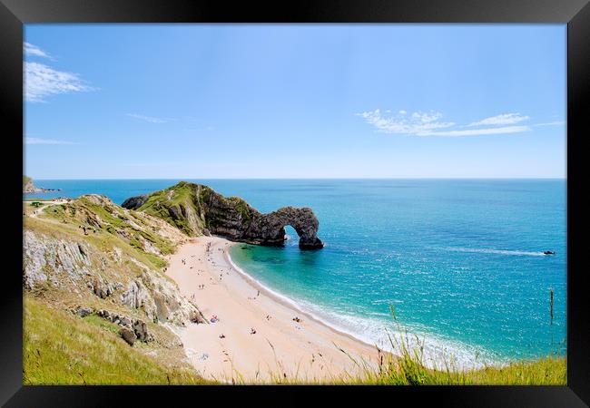 Durdle door and beach in the Summer sunshine. Framed Print by Simon J Beer