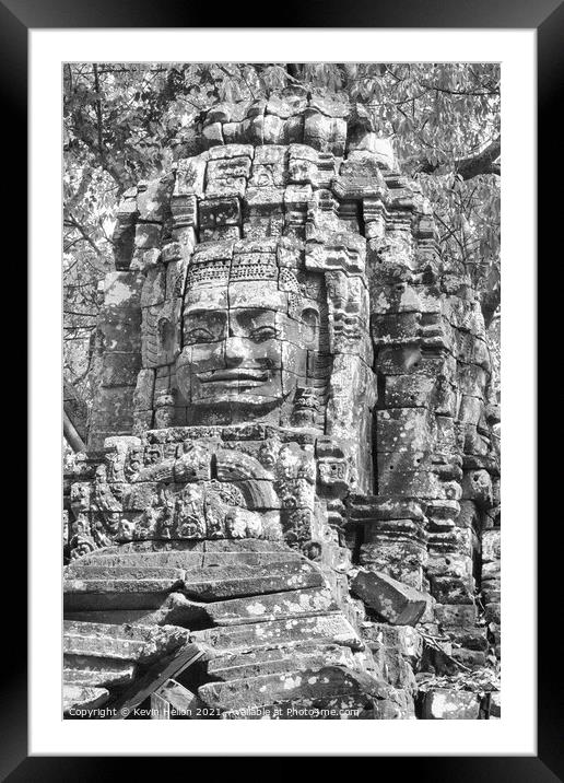 Face on temple building Framed Mounted Print by Kevin Hellon