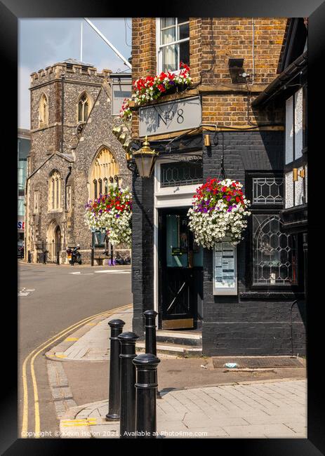 Entrance to the Metropolitan Tavern with St Margaret's church in Framed Print by Kevin Hellon