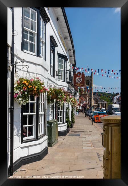 Hanging baskets outside the Catherine Wheel pub  Framed Print by Kevin Hellon