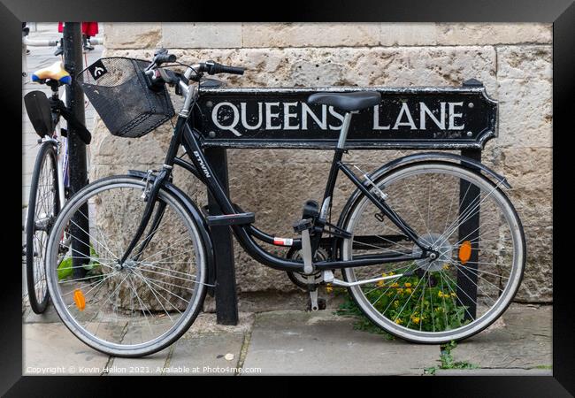 Bicycle locked to the street sign for Queen's Lane, Oxford, Framed Print by Kevin Hellon