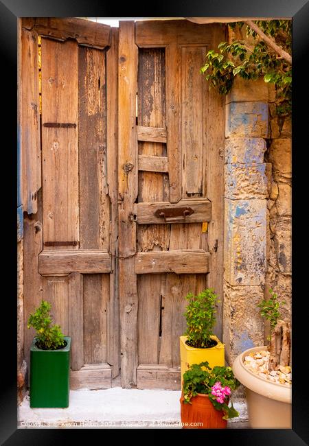 Colourful plant containers and old wooden doors, Framed Print by Kevin Hellon