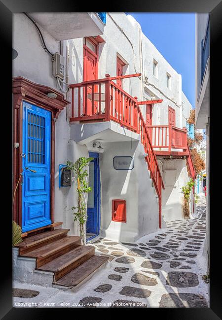 Typical street on the island of Mykonos, Greece Framed Print by Kevin Hellon