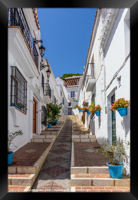 Steep street with blue plantpots, Mijas Framed Print by Kevin Hellon