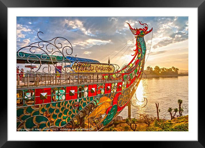 Dragon boat prow at sunset Framed Mounted Print by Kevin Hellon