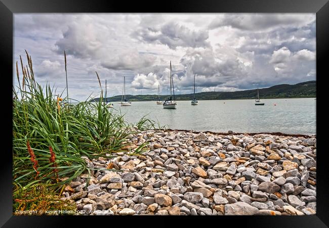 Yachts moored in Red Wharf Bay Framed Print by Kevin Hellon