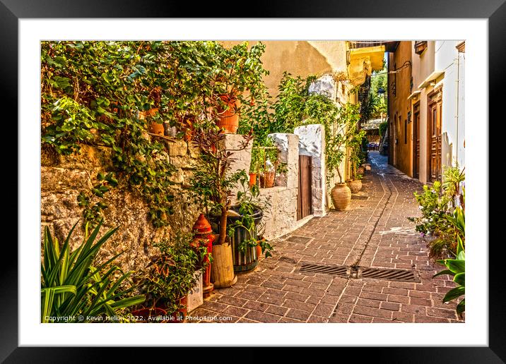 Narrow street in Chania old town Framed Mounted Print by Kevin Hellon