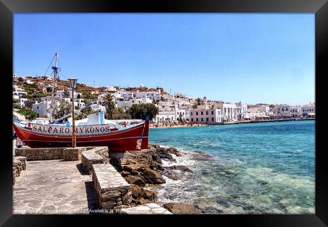 Clear waters of the Mediterranean sea and harbour Chora, Mykonos Framed Print by Kevin Hellon