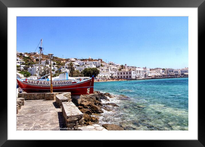 Clear waters of the Mediterranean sea and harbour Chora, Mykonos Framed Mounted Print by Kevin Hellon