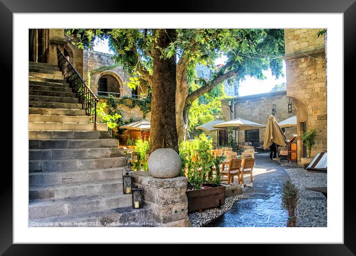 Sunny courtyard in Rhodes Town, Greece Framed Mounted Print by Kevin Hellon