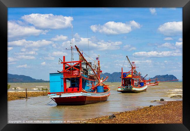 Thai fishing boats anchored in Koh Lanta, Krabi, Thailand Framed Print by Kevin Hellon