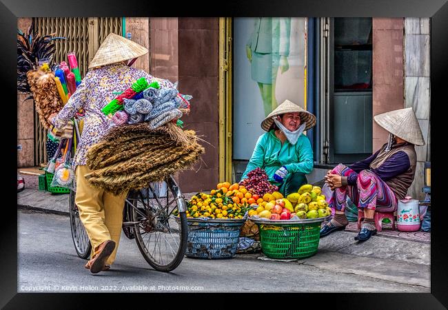 3 street vendors, Ho Chi Minh City, Saigon, Vietnam Framed Print by Kevin Hellon