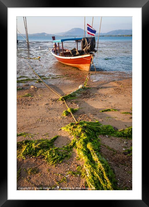 Thai long tail boat moored on sand Framed Mounted Print by Kevin Hellon