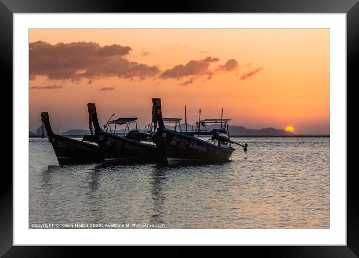 Long tail boats at sunrise. Framed Mounted Print by Kevin Hellon