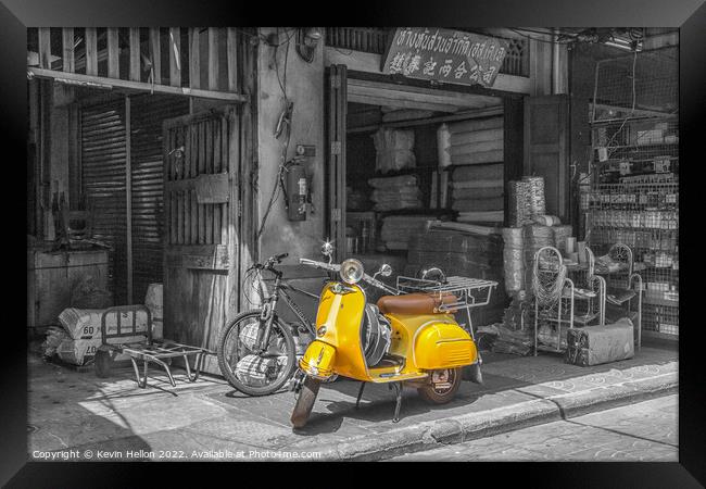 Yellow scooter, Bangkok Framed Print by Kevin Hellon