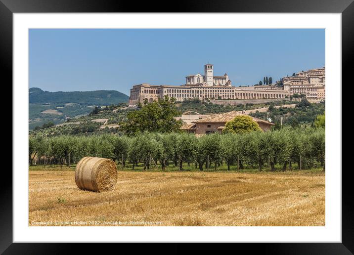 Hay roll overlooked by the Basilica di San Francesco D'Assisi, Umbria, Italy Framed Mounted Print by Kevin Hellon
