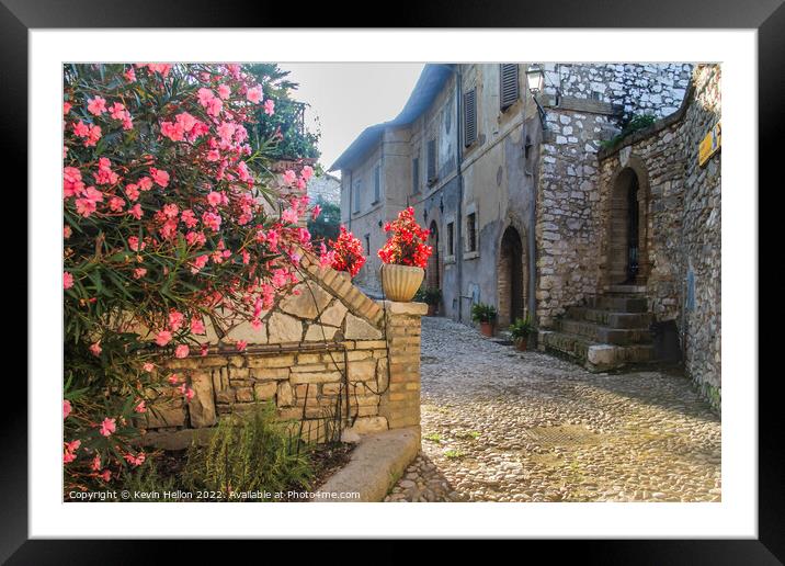 Narrow, cobbled street with flowers, Framed Mounted Print by Kevin Hellon