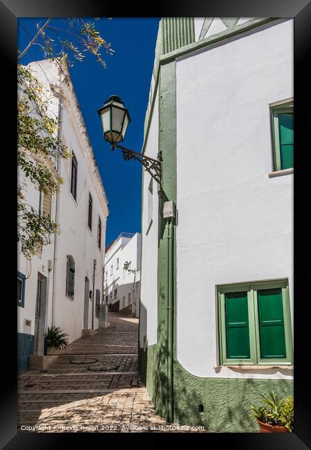Narrow, steep street, Albufeira old town, Framed Print by Kevin Hellon