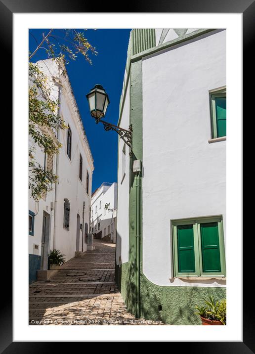Narrow, steep street, Albufeira old town, Framed Mounted Print by Kevin Hellon