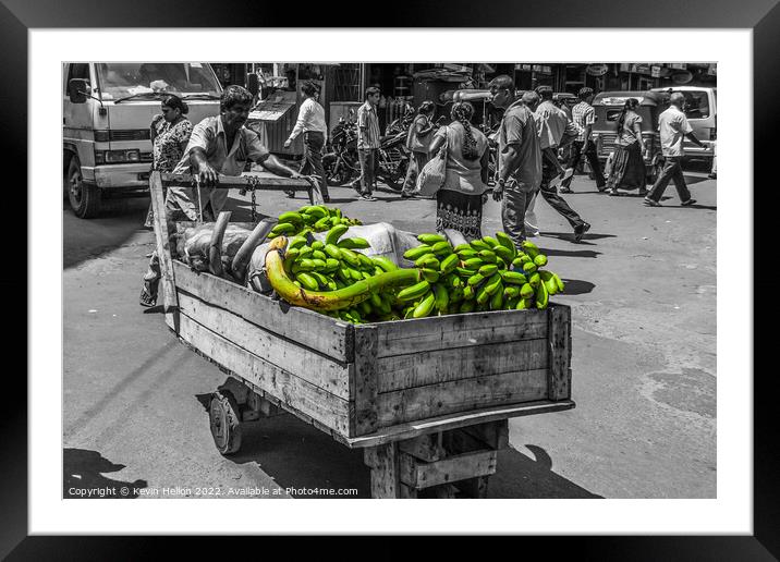 Man pushing crt of bananas in Colombo, Sri Lanka Framed Mounted Print by Kevin Hellon
