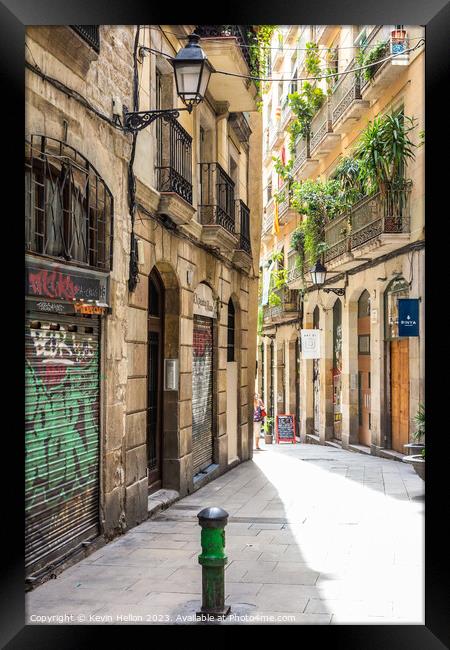 Typical narrow street in the Gothic quarter of Barcelona, Spain Framed Print by Kevin Hellon