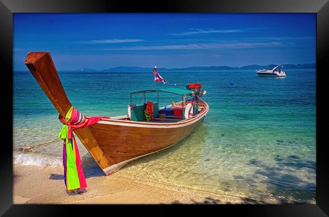 Long tail boat with power boat in the background on Koh Naka isl Framed Print by Kevin Hellon
