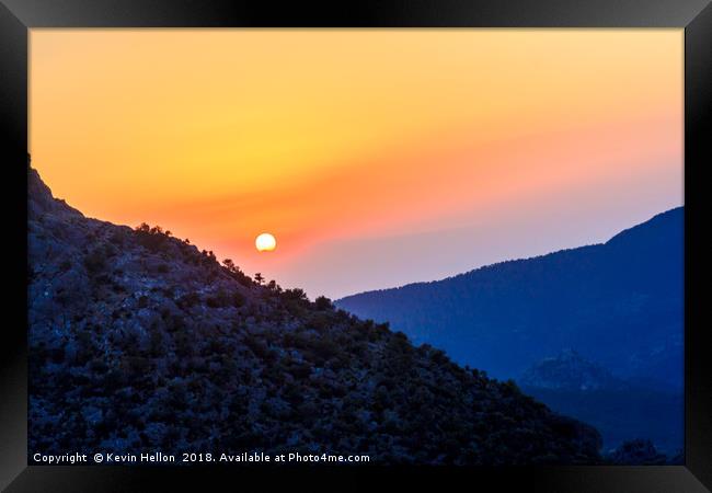 Sunset over the mountains  Framed Print by Kevin Hellon