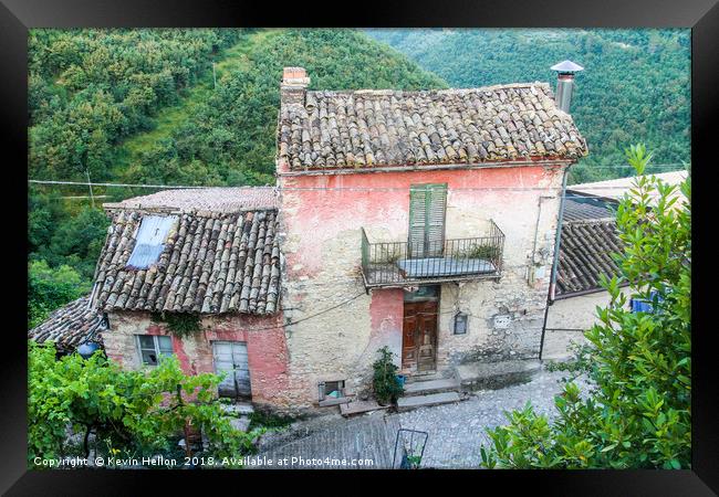 Old house set amongst the hills Framed Print by Kevin Hellon