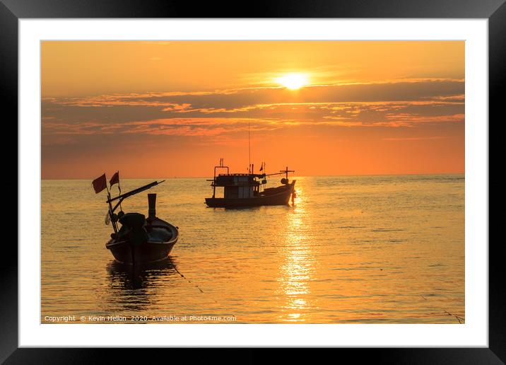 Silhouettes of boats on Bang Tao Beach Framed Mounted Print by Kevin Hellon