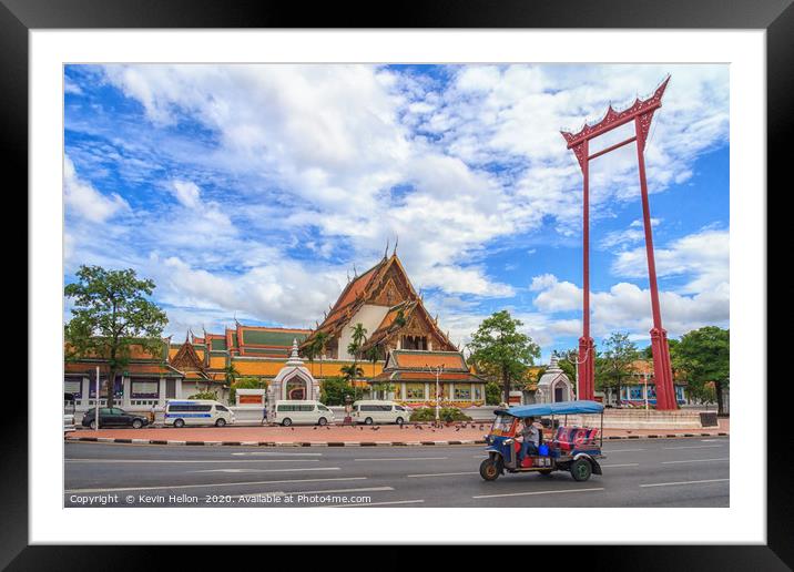A tuk tuk drives past the Giant Swing Framed Mounted Print by Kevin Hellon