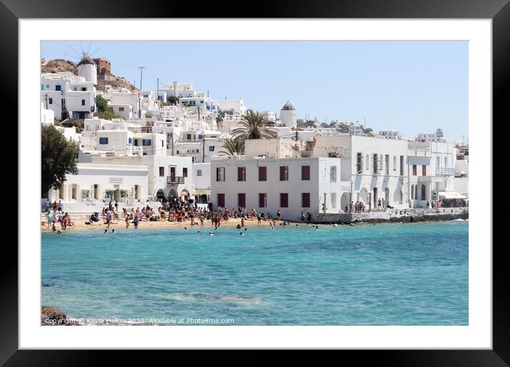 Tourists relaxing on the beach in Chora, Mykonos,  Framed Mounted Print by Kevin Hellon
