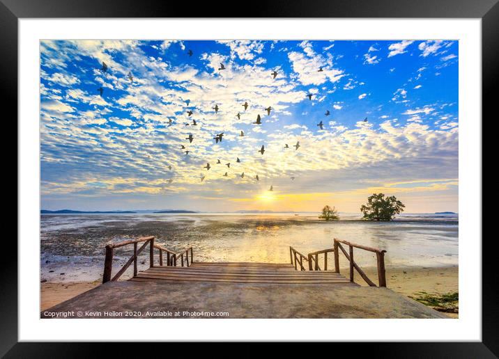 Sunrise with sunrays and flock of birds Framed Mounted Print by Kevin Hellon