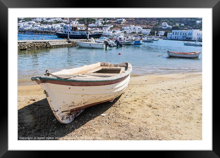 Small boat beached on sand  Framed Mounted Print by Kevin Hellon