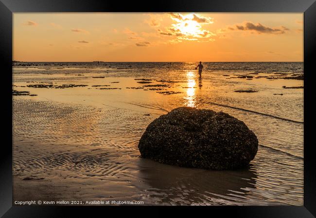 Rock and fisherman silhouette  Framed Print by Kevin Hellon