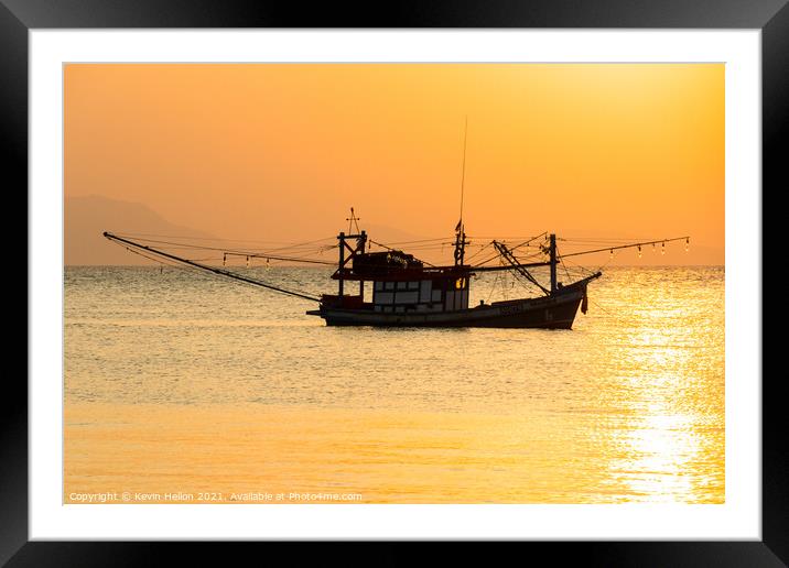 Fishing boat at sunset Framed Mounted Print by Kevin Hellon