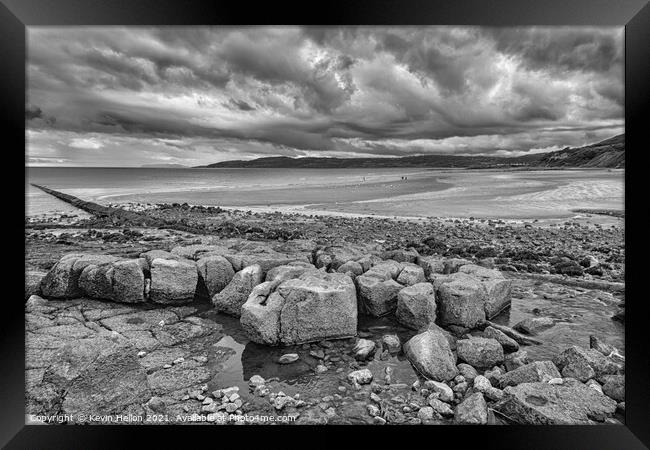 Stormy skies over Benllech Beach Framed Print by Kevin Hellon