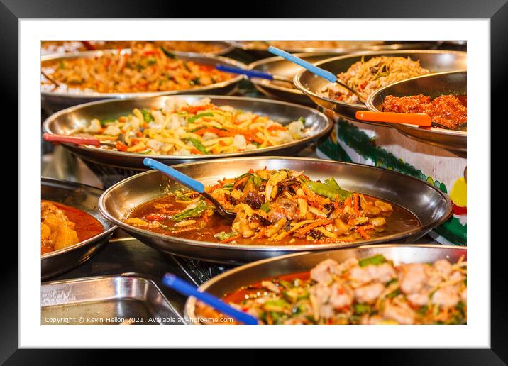 Platters of Thai food on a street food stall Framed Mounted Print by Kevin Hellon