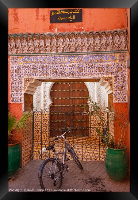 Moroccan doorway and bicycle Framed Print by Kevin Hellon