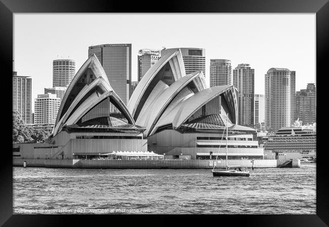 A yacht cruises by the Opera House Framed Print by Kevin Hellon