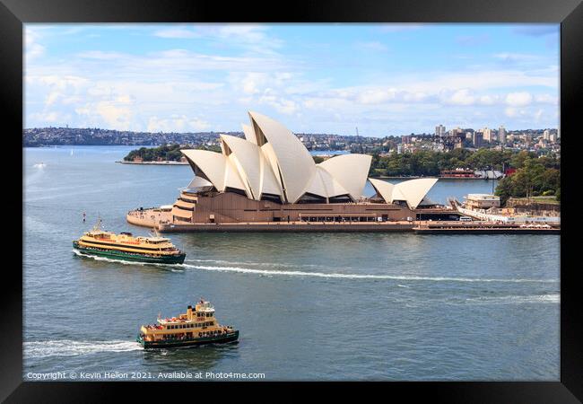 Ferries passing the Sydney Opera House Framed Print by Kevin Hellon